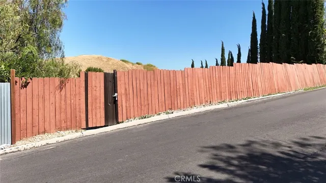 a view of a backyard of the house