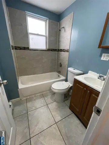 a bathroom with a sink a toilet and bathtub