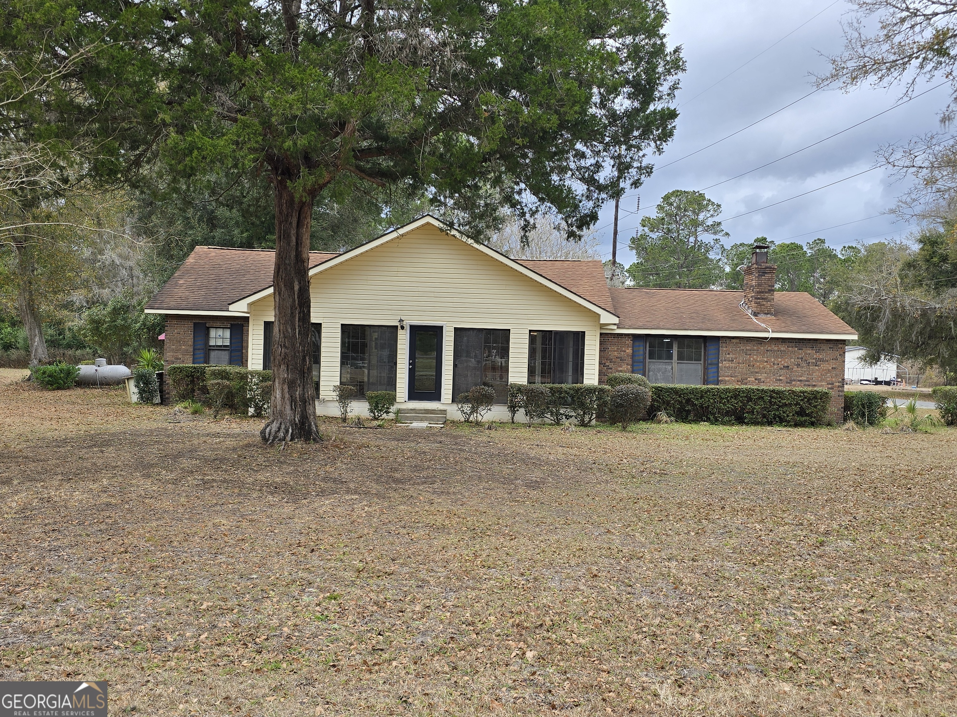1703 Point Peter Road St. Marys, GA 31558 - Photo 1 of 1 a front view of a house with a garden