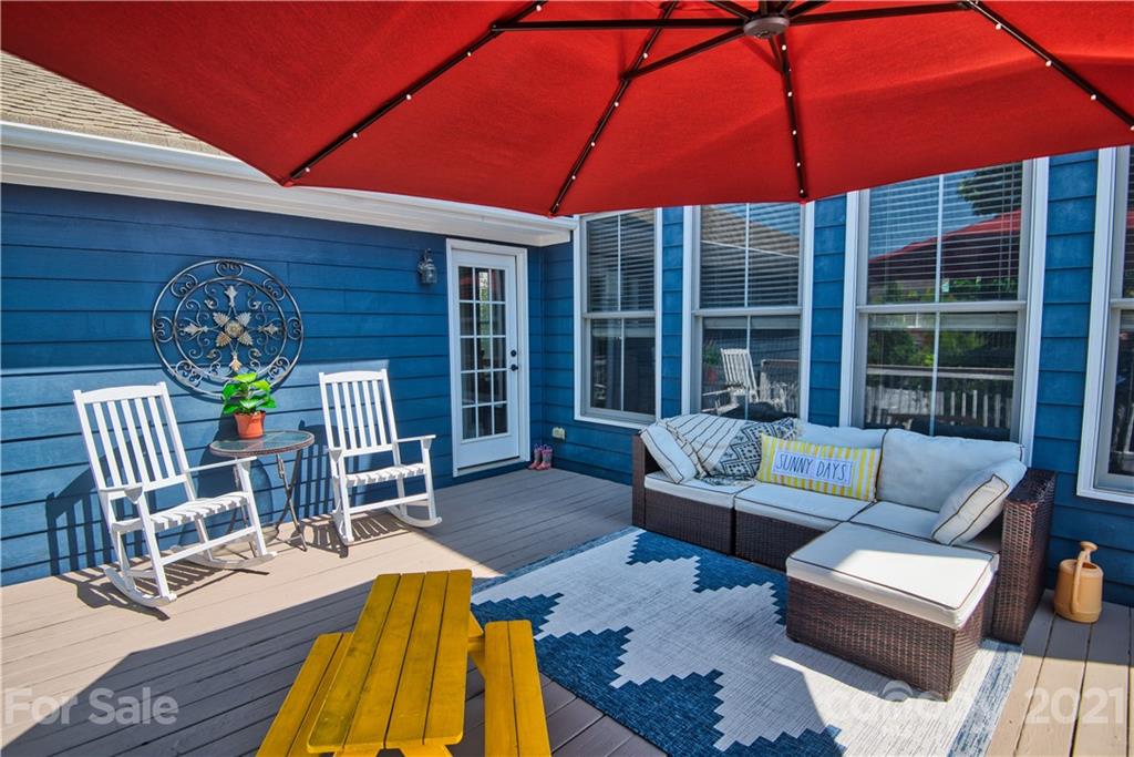 3349 Richard's Crossing Fort Mill, SC 29708 - Photo 29 of 33 a view of a patio with table and chairs under an umbrella