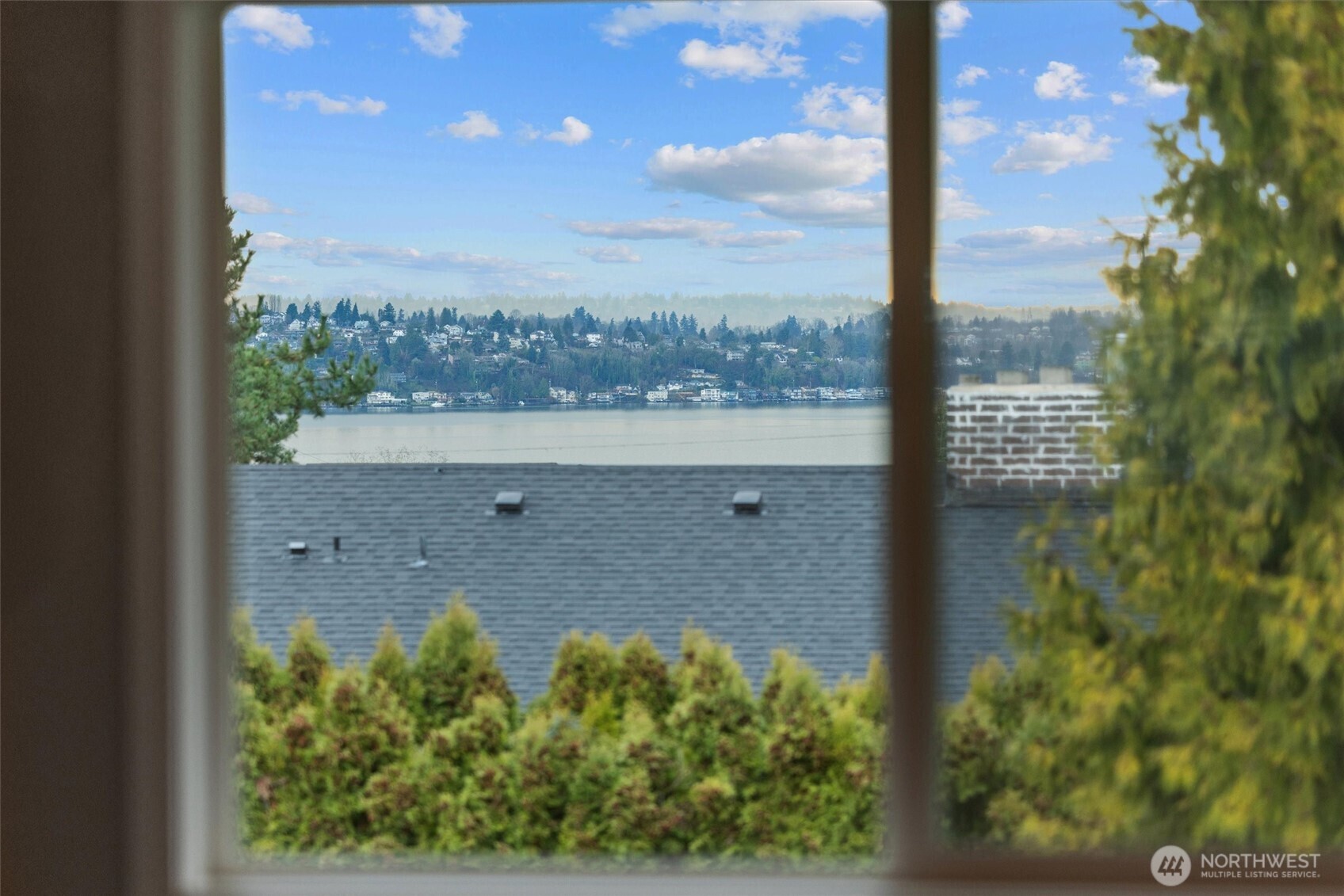 3415 Garden Avenue North Renton, WA 98056 - Photo 14 of 34 a view of a floor to ceiling window next to a yard