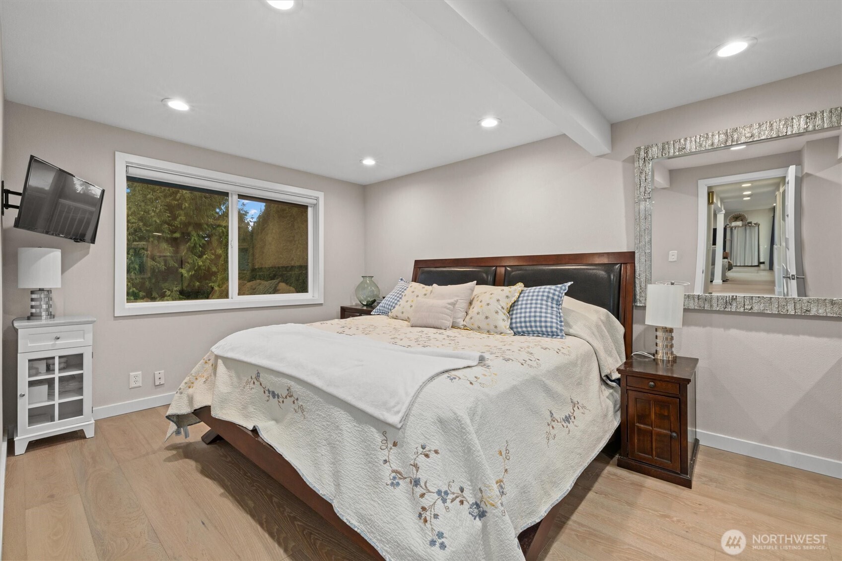 3415 Garden Avenue North Renton, WA 98056 - Photo 16 of 34 a bedroom with a large bed and a window