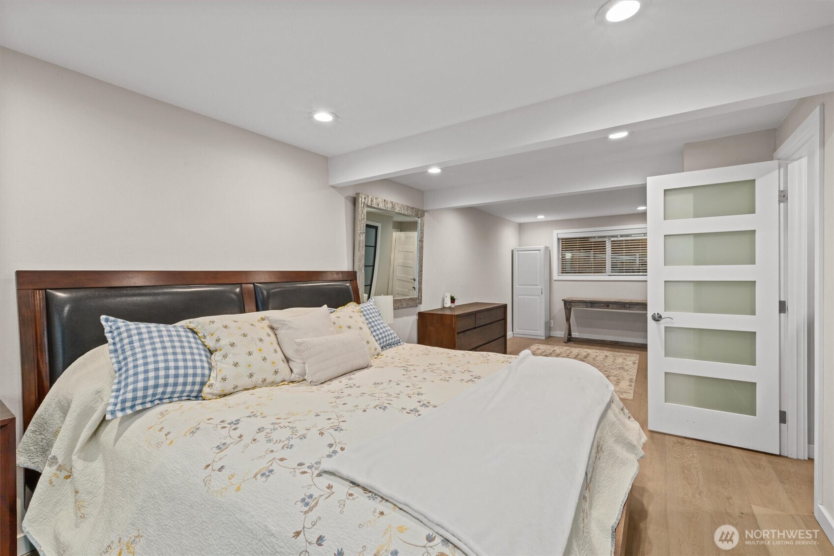 3415 Garden Avenue North Renton, WA 98056 - Photo 17 of 34 a bed room with a bed and a television