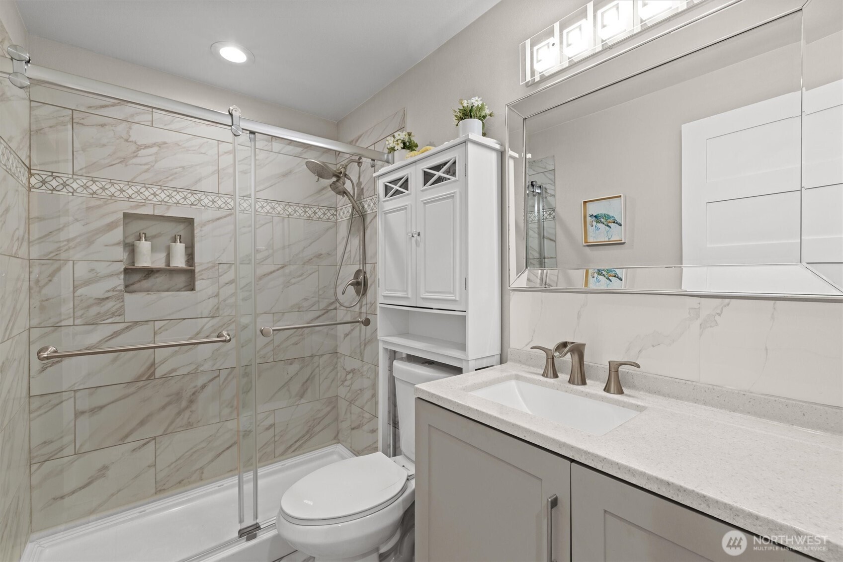 3415 Garden Avenue North Renton, WA 98056 - Photo 19 of 34 a bathroom with a sink a toilet and shower