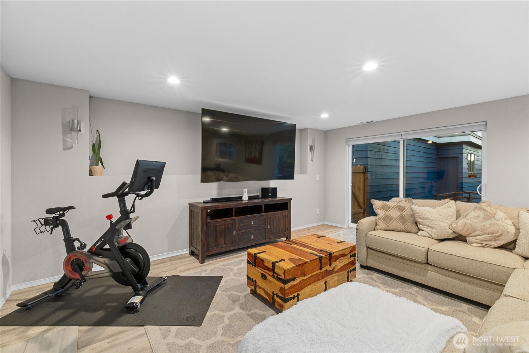 3415 Garden Avenue North Renton, WA 98056 - Photo 22 of 34 a living room with furniture flat screen tv and a window