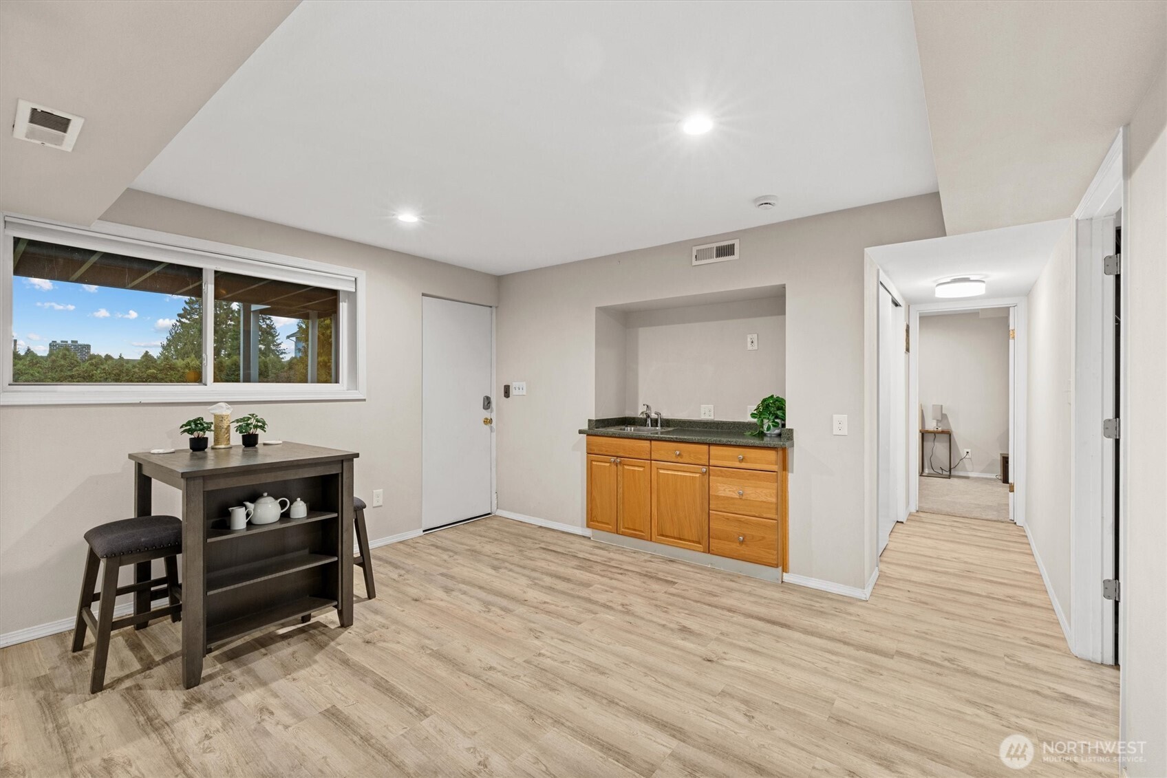 3415 Garden Avenue North Renton, WA 98056 - Photo 23 of 34 a spacious bedroom with a bed and a dresser in it