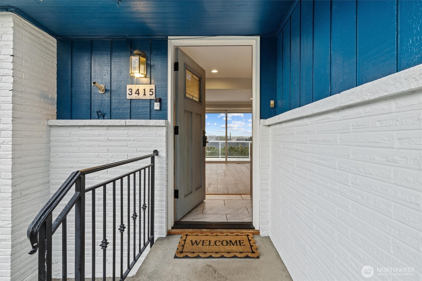 3415 Garden Avenue North Renton, WA 98056 - Photo 4 of 34 a view of a hallway with wooden floor and staircase