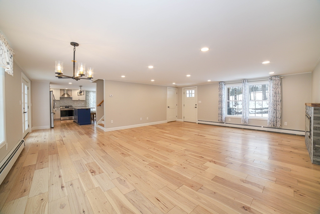 3 Woods Road Westminster, MA 01473 - Photo 13 of 42 a view of an empty room with window and wooden floor