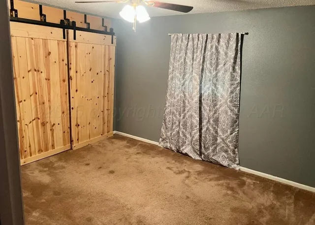 a view of a bunch of curtain and chandelier fan