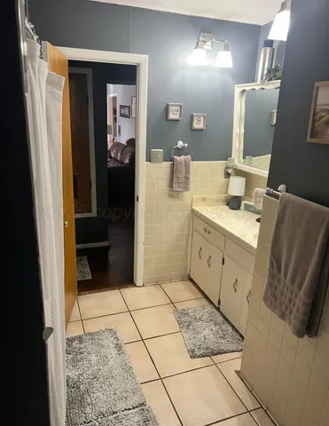 a bathroom with a mirror and a sink
