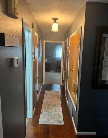 a view of a bathroom from the hallway