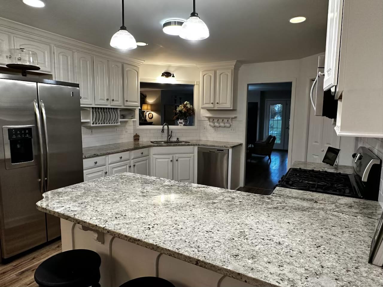 2668 Ragsdale Road Manchester, TN 37355 - Photo 8 of 32 a kitchen with stainless steel appliances granite countertop a sink refrigerator stove and microwave
