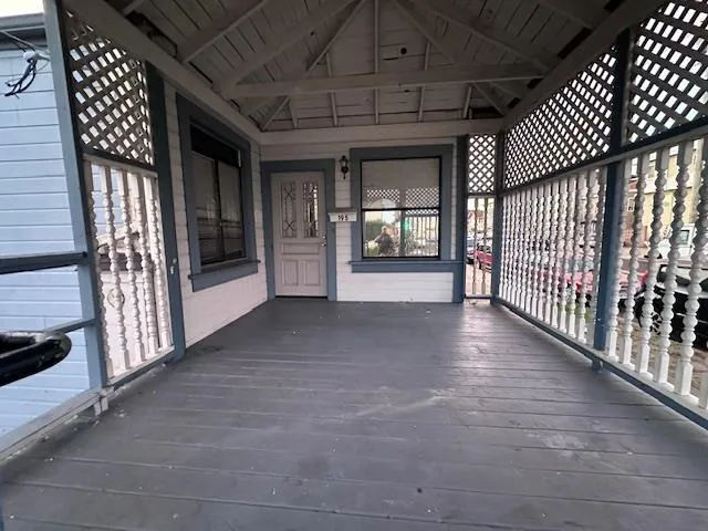 a view of gallery with wooden floor
