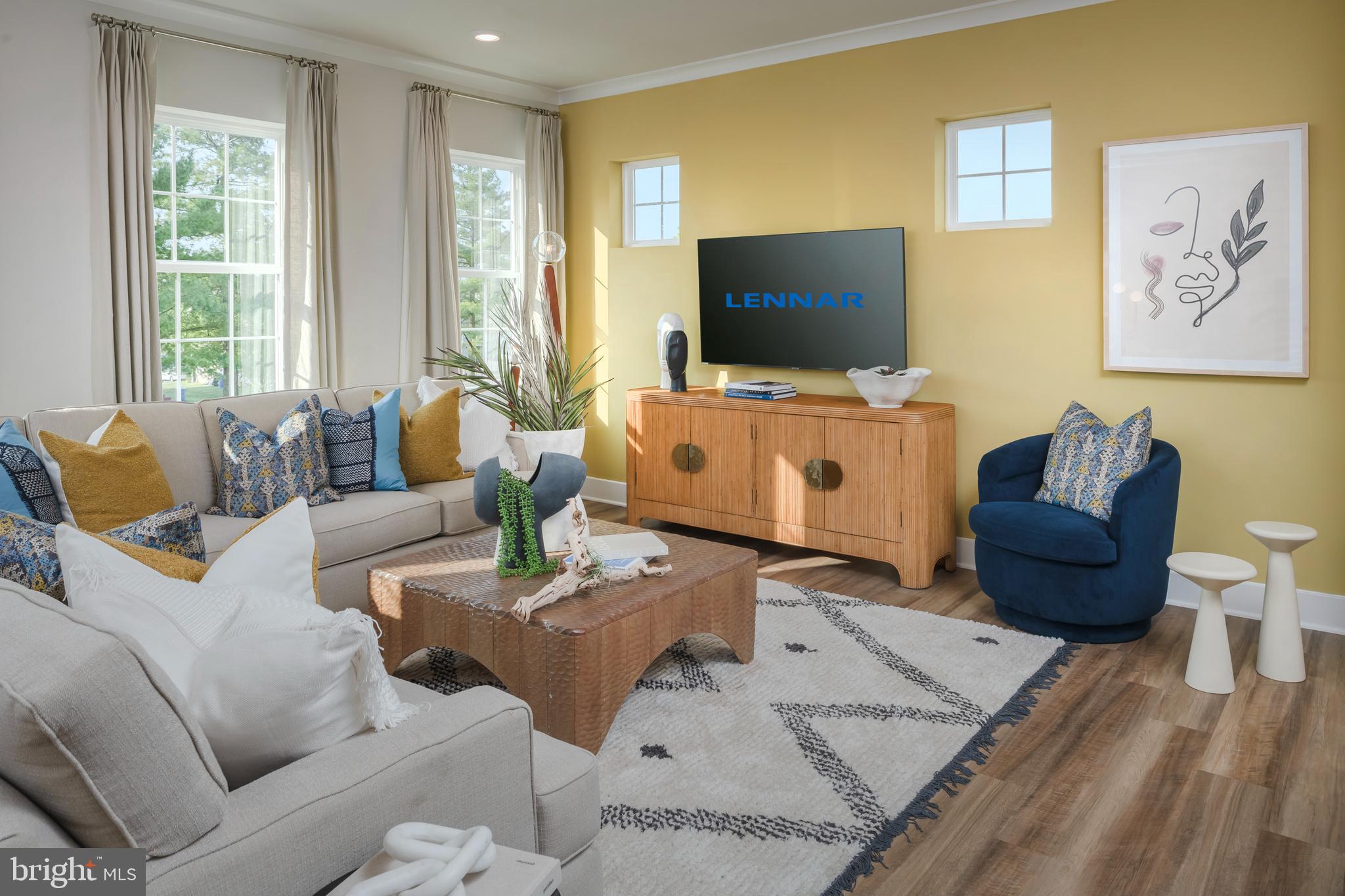 7708 Johnnycake Road Windsor Mill, MD 21244 - Photo 7 of 18 a living room with furniture and a flat screen tv