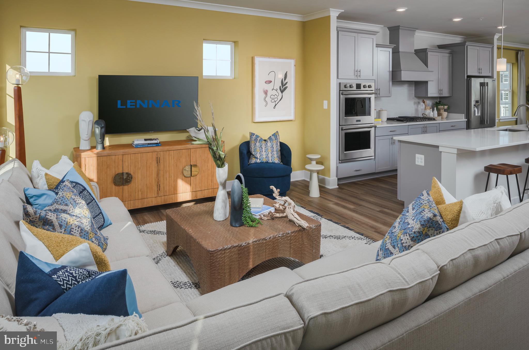 7708 Johnnycake Road Windsor Mill, MD 21244 - Photo 8 of 18 a living room with furniture and a flat screen tv