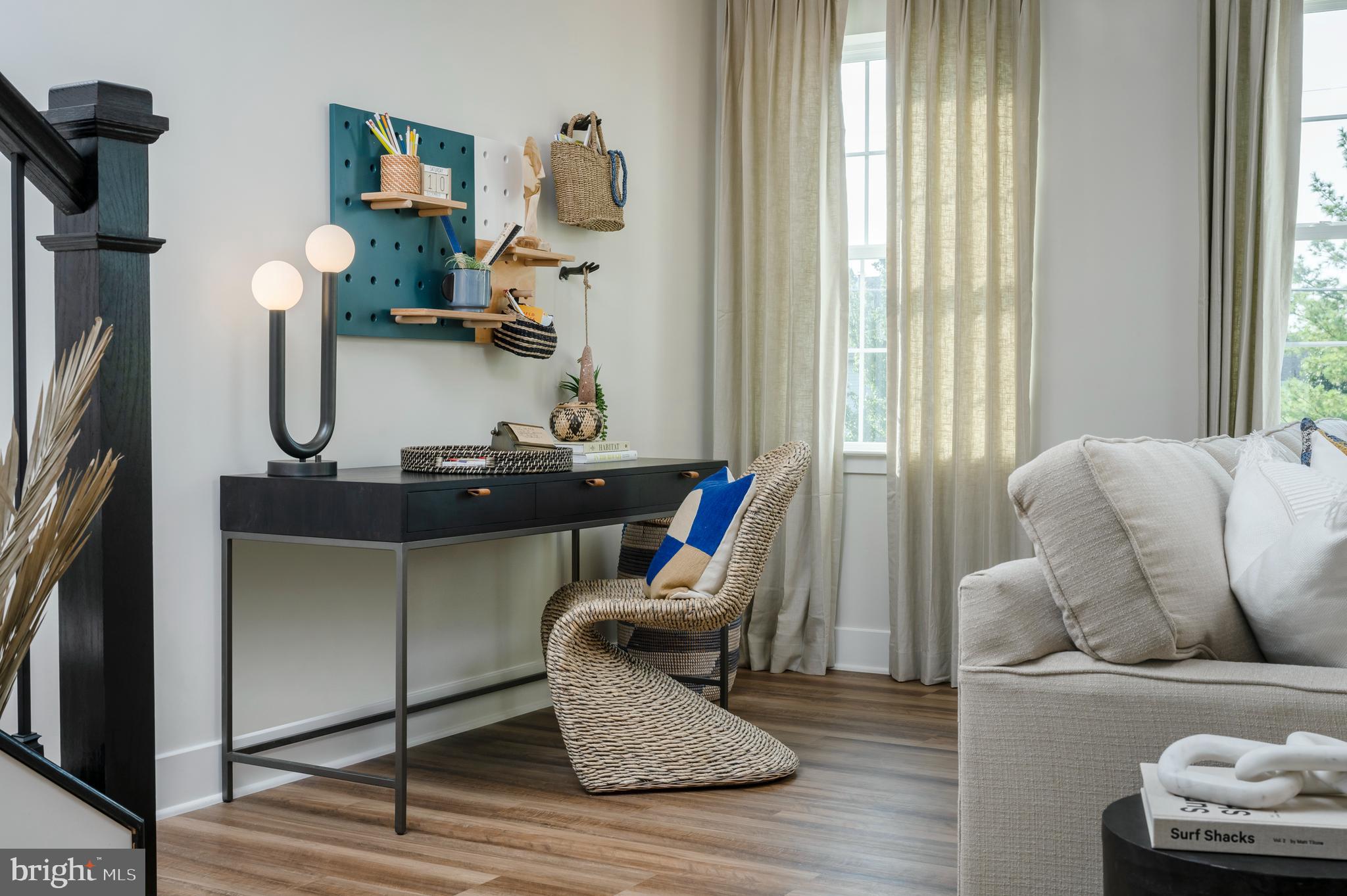 7708 Johnnycake Road Windsor Mill, MD 21244 - Photo 9 of 18 a living room with furniture and a flat screen tv