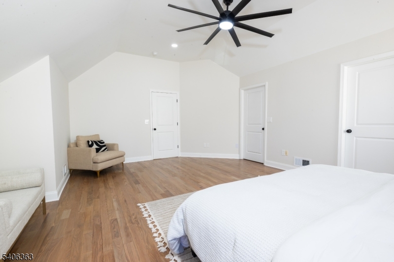 13 Sycamore Way Warren, NJ 07059 - Photo 19 of 50 a bedroom with a bed and a chandelier