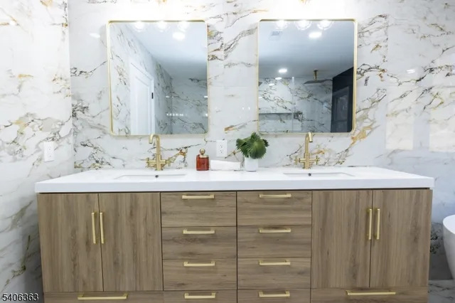 a bathroom with a sink vanity and a mirror