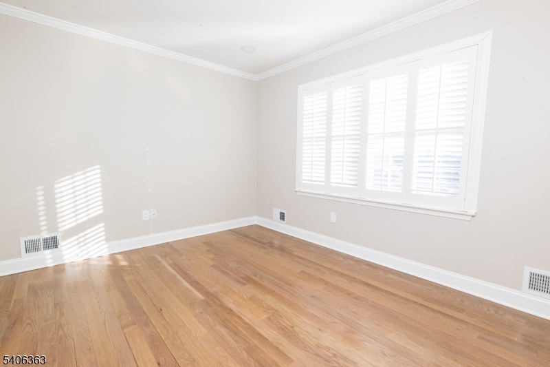 13 Sycamore Way Warren, NJ 07059 - Photo 33 of 50 an empty room with wooden floor and windows