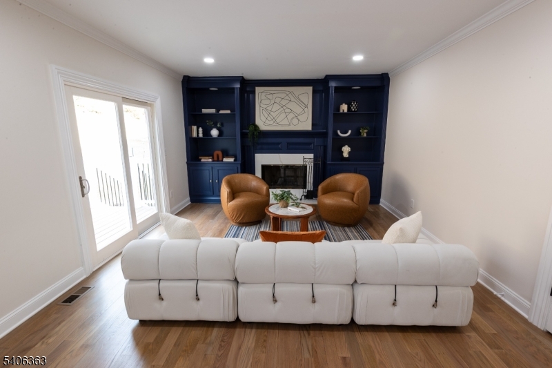 13 Sycamore Way Warren, NJ 07059 - Photo 9 of 50 a living room with furniture a fireplace and a window