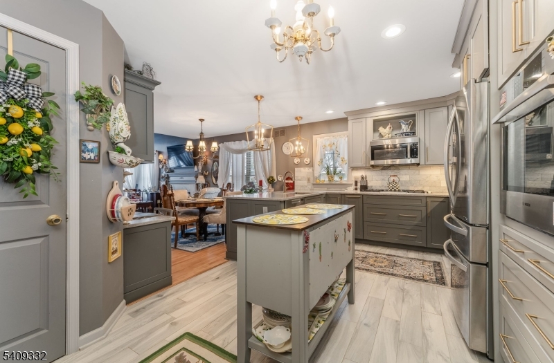 7 Rachel Court Clinton, NJ 08809 - Photo 12 of 42 a kitchen with stainless steel appliances granite countertop a sink stove and refrigerator