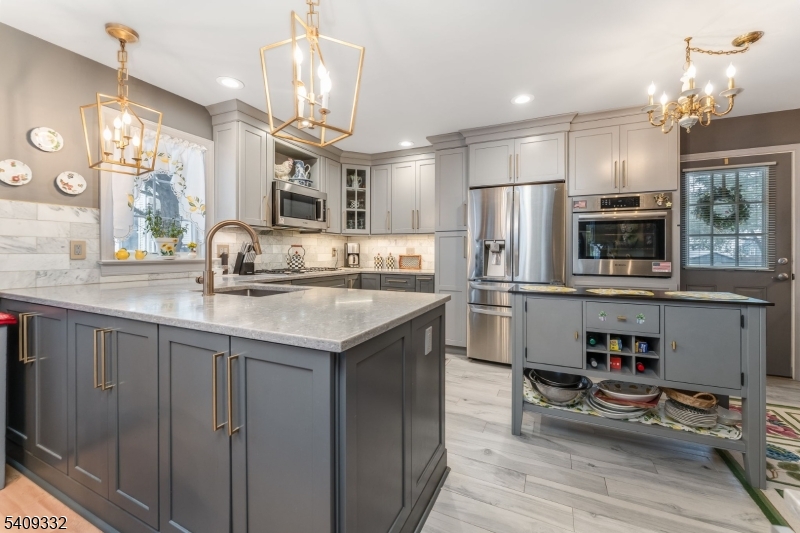 7 Rachel Court Clinton, NJ 08809 - Photo 13 of 42 a kitchen with stainless steel appliances granite countertop a sink and refrigerator