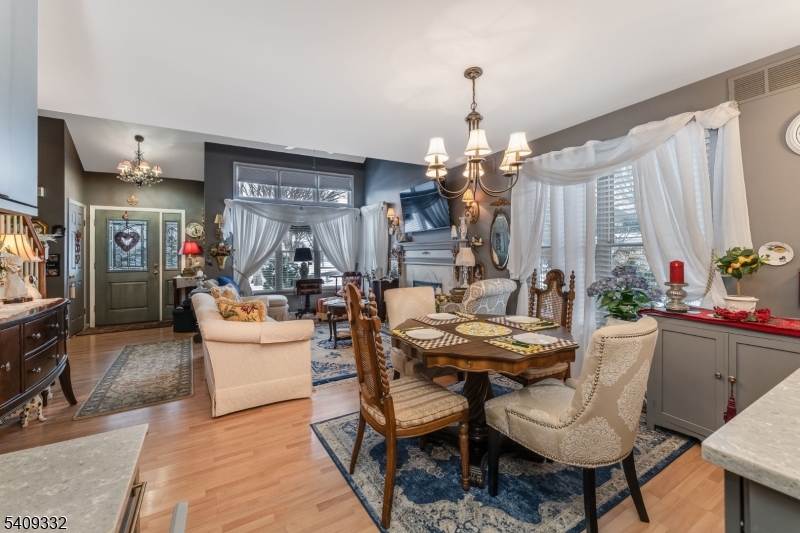 7 Rachel Court Clinton, NJ 08809 - Photo 16 of 42 a view of a dining room with furniture and chandelier