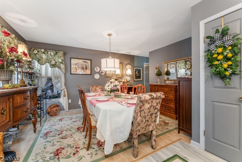 7 Rachel Court Clinton, NJ 08809 - Photo 20 of 42 a view of a dining room with furniture and a potted plant