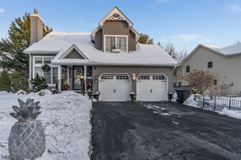 7 Rachel Court Clinton, NJ 08809 - Photo 2 of 42 a view of a white house with a large windows and table and chairs in a yard