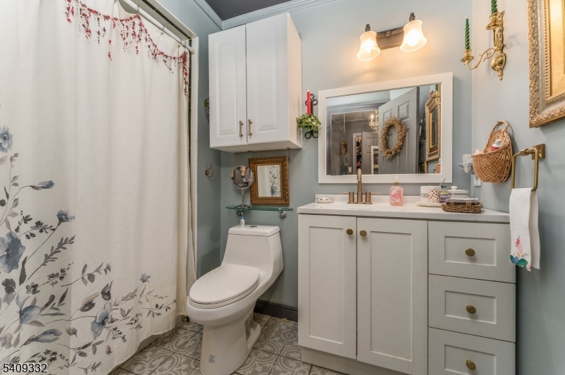 7 Rachel Court Clinton, NJ 08809 - Photo 23 of 42 a bathroom with a granite countertop sink mirror vanity and toilet