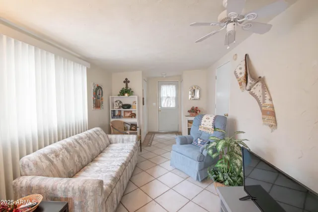 a view of a patio with table and chairs and potted plants