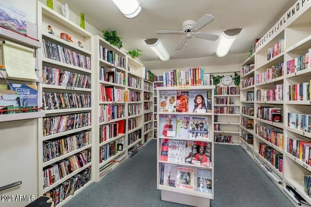 a view of a patio with table and chairs