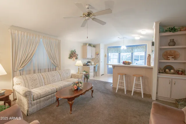 a kitchen with a sink a stove a refrigerator and cabinets