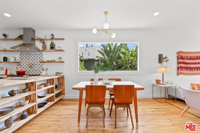 a view of a dining room with furniture and a wooden floor