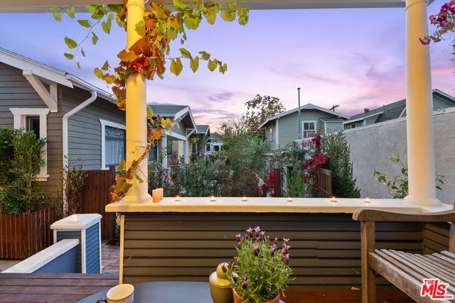 a view of a bench in a back yard of a building