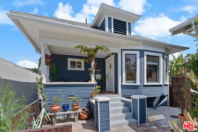 a view of an house with porch and wooden floor