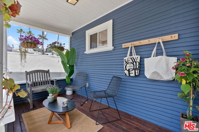 a view of a deck with furniture