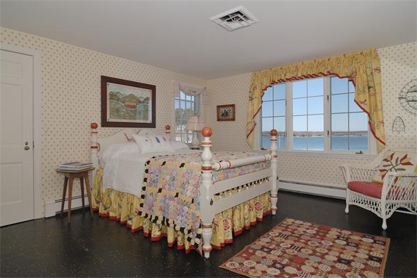56 Sand Point Barnstable, MA 02655 - Photo 15 of 20 a room with furniture and a baby crib