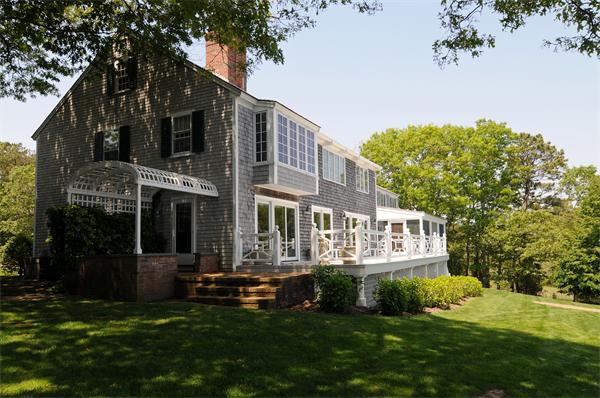 56 Sand Point Barnstable, MA 02655 - Photo 4 of 20 a view of a house with a yard porch and sitting area