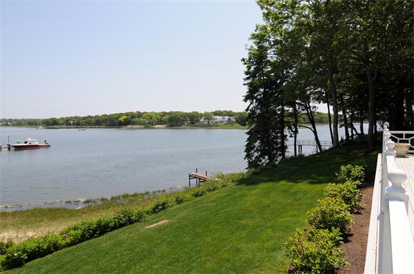 56 Sand Point Barnstable, MA 02655 - Photo 6 of 20 a view of a lake with a big yard