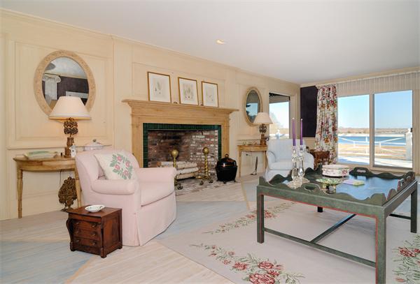 56 Sand Point Barnstable, MA 02655 - Photo 8 of 20 a living room with furniture a fireplace and a large window