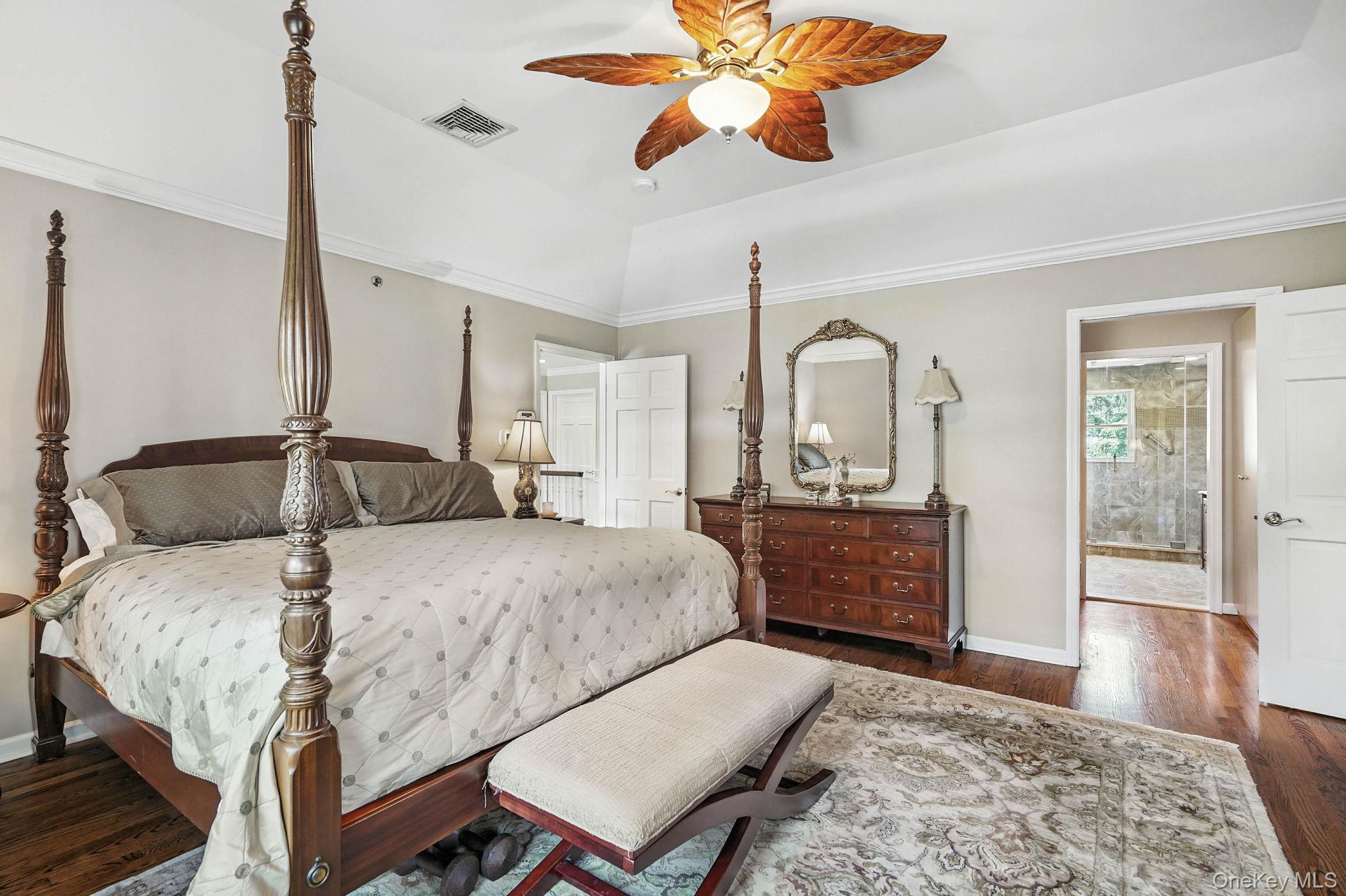 33 Hevelyne Road Elmsford, NY 10523 - Photo 27 of 43 Bedroom featuring raised ceiling, Large walk-in closet and dressing area with attached ensuite double vanity bathroom.