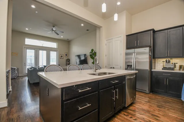 a kitchen with a sink stove and refrigerator