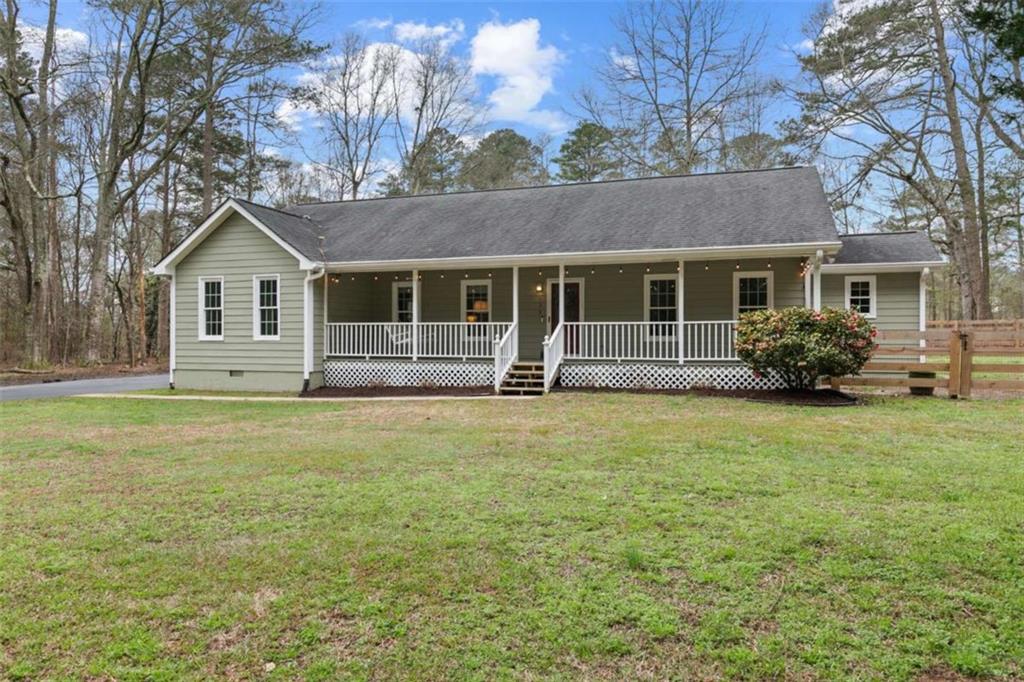 138 Adams Road Fayetteville, GA 30214 - Photo 1 of 38 a front view of house with yard and green space
