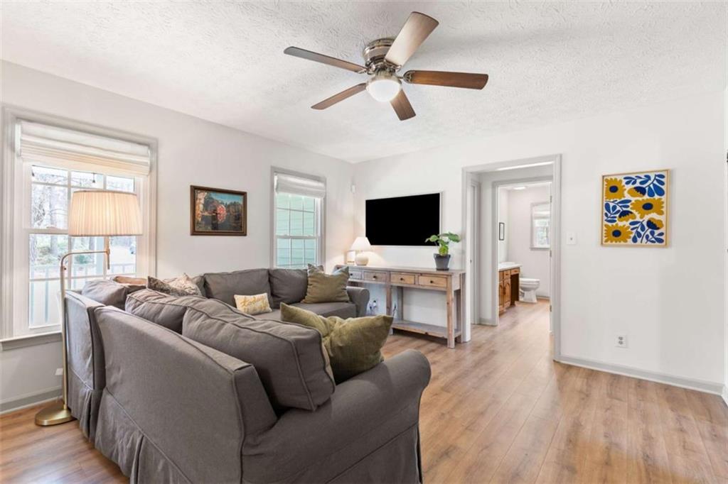 138 Adams Road Fayetteville, GA 30214 - Photo 11 of 38 a living room with furniture and a flat screen tv