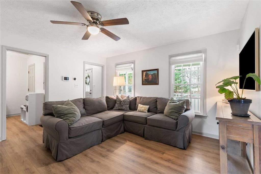 138 Adams Road Fayetteville, GA 30214 - Photo 12 of 38 a living room with furniture ceiling fan and a window