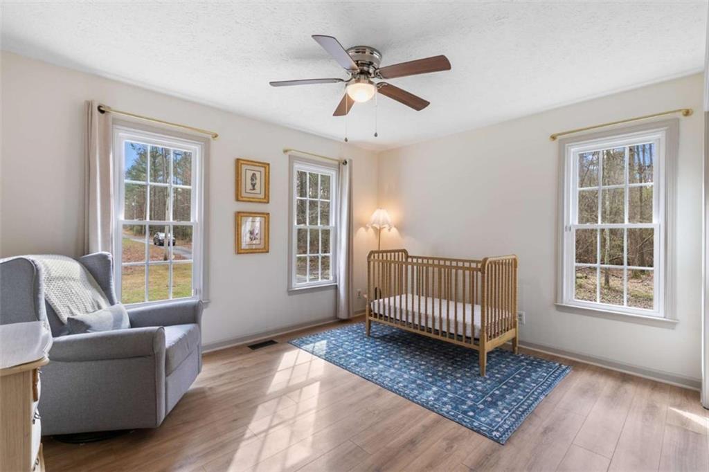 138 Adams Road Fayetteville, GA 30214 - Photo 13 of 38 a living room with a couch and a window