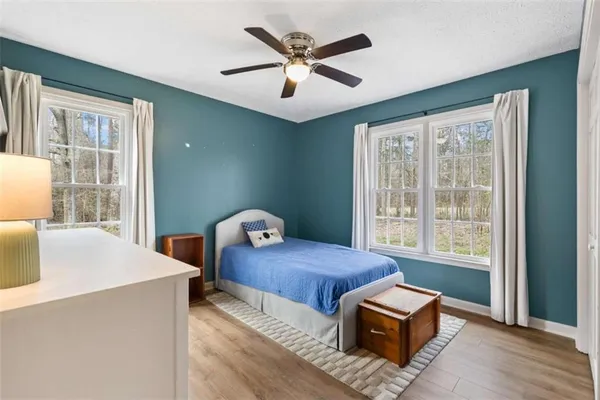 a bedroom with furniture and window