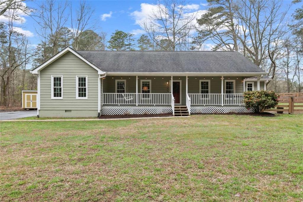 138 Adams Road Fayetteville, GA 30214 - Photo 2 of 38 a house view with a garden space
