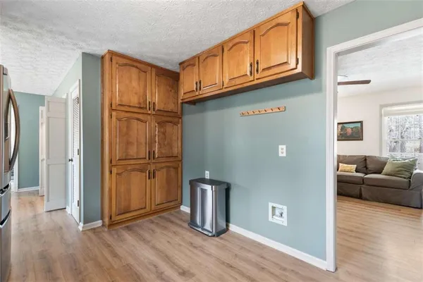 a view of livingroom with hardwood floor and furniture